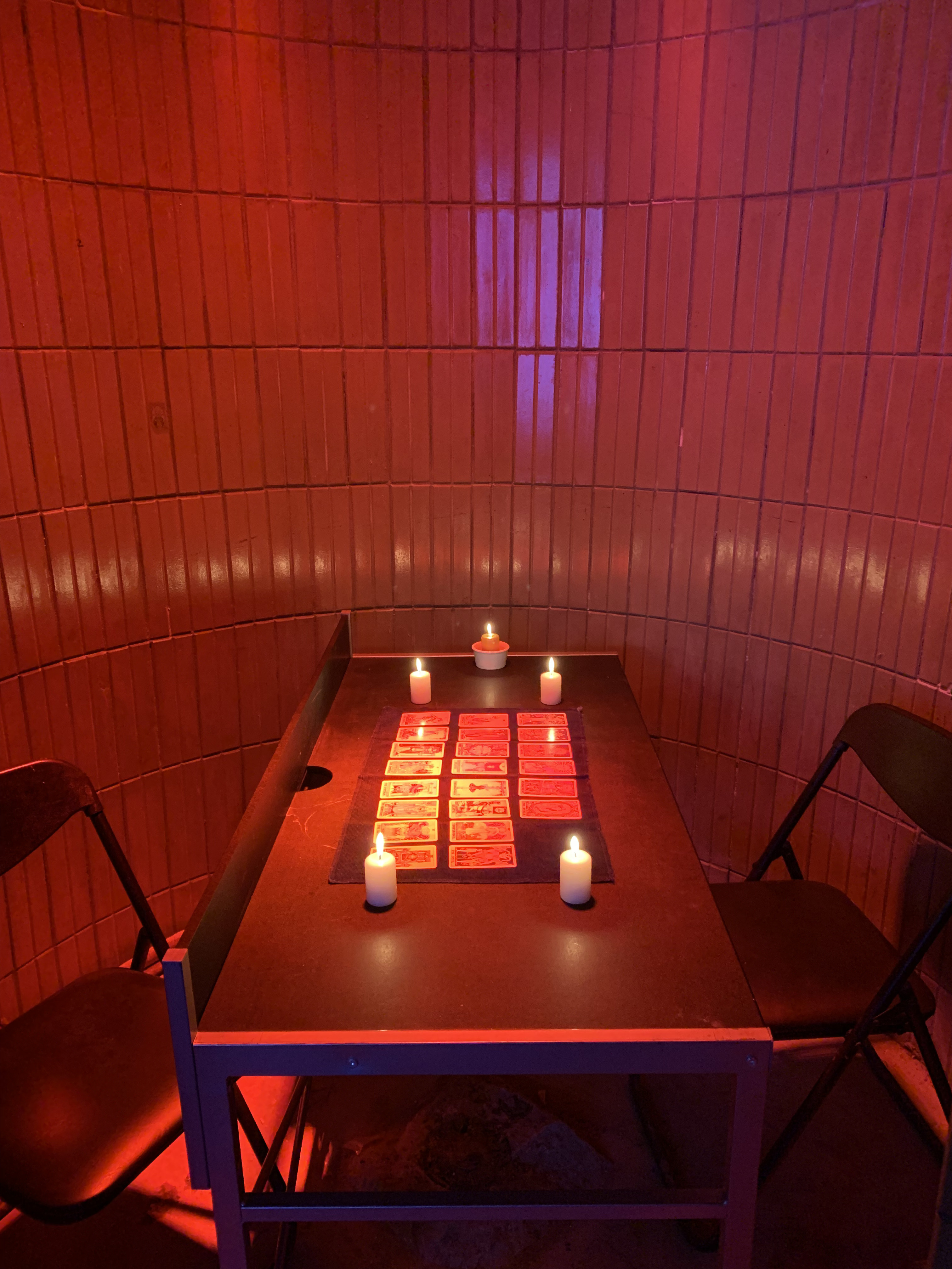 Tanya Fishmann, Cards on the Table, 2021, empty performance setup with Tarot cards and candles before the encounter at Dzherelo Gallery