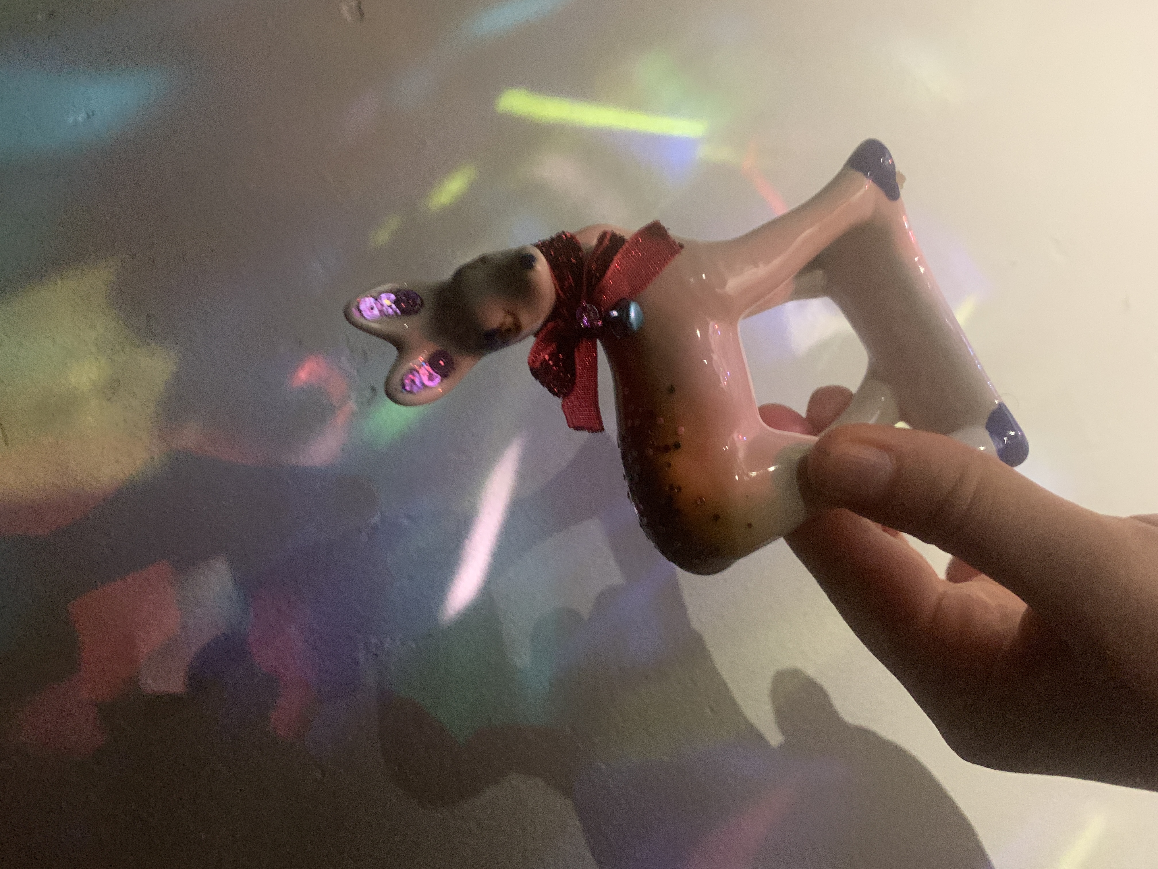 Tanya Fishmann, Queer Deer of Ukraine #1, 2022, altered Soviet-era porcelain deer figurine with projected light intervention, symbol of fluid identity and transformation